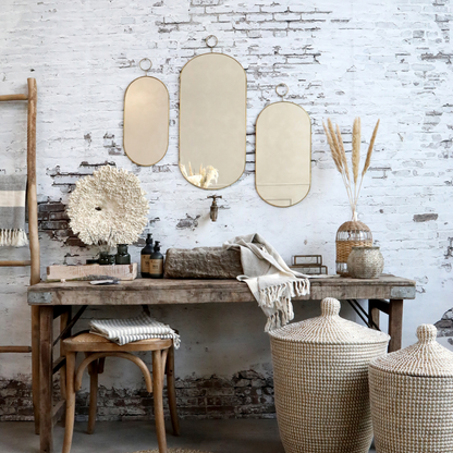 Miroir ovale avec cadre en laiton