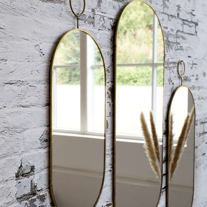 Miroir ovale avec cadre en laiton