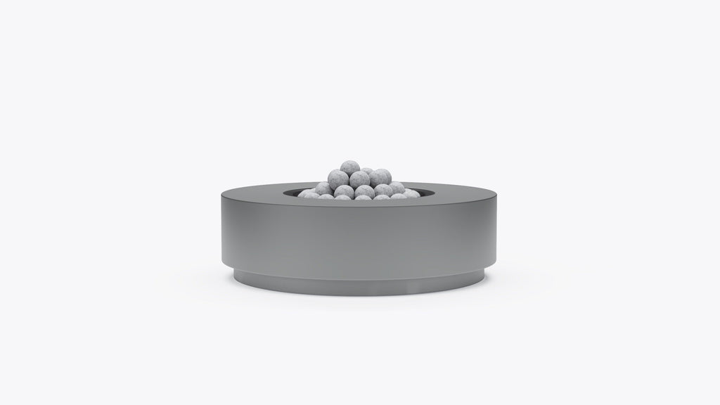 Table ronde en béton avec foyer